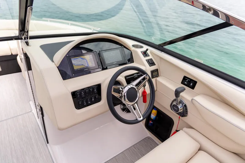 Slide: The Image of 2022 Regal 2800 Bowrider boat interior with seating and speaker system. - 14