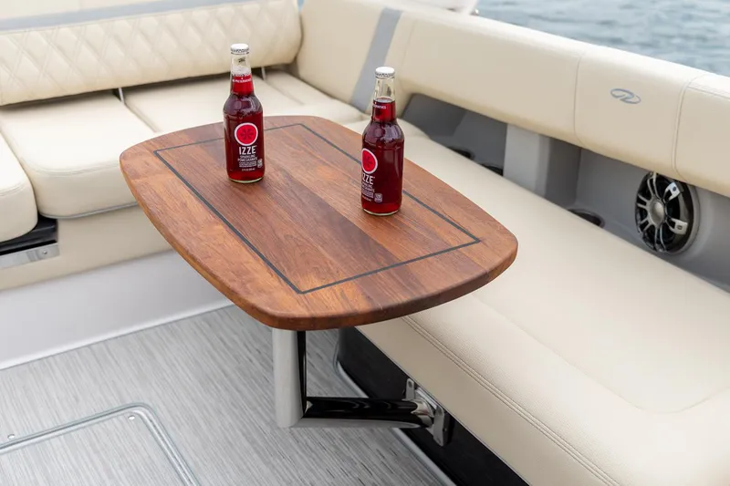 Slide: The Image of 2022 Regal 2800 Bowrider with spacious seating, docked on calm water. - 19