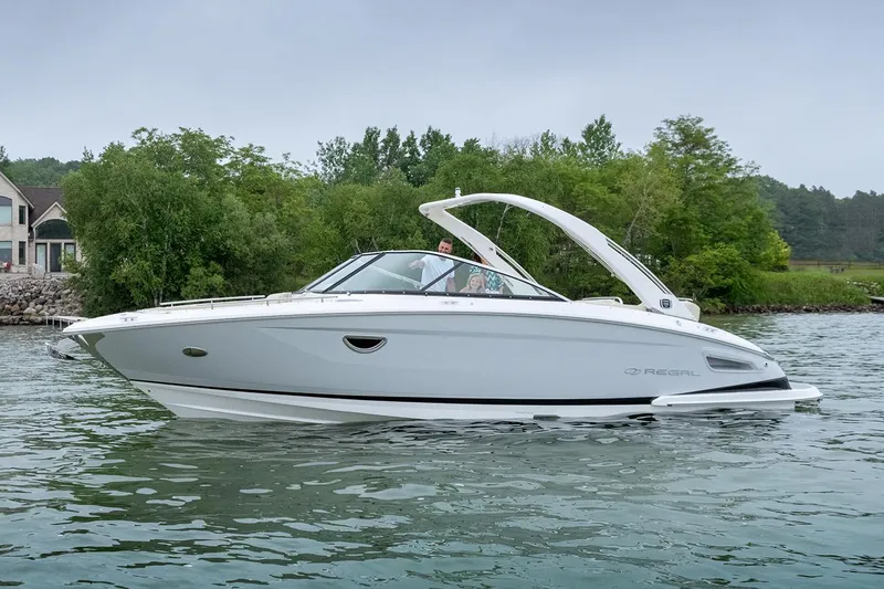Slide: The Image of 2022 Regal 2800 Bowrider interior with white seating and stainless steel accents. - 8