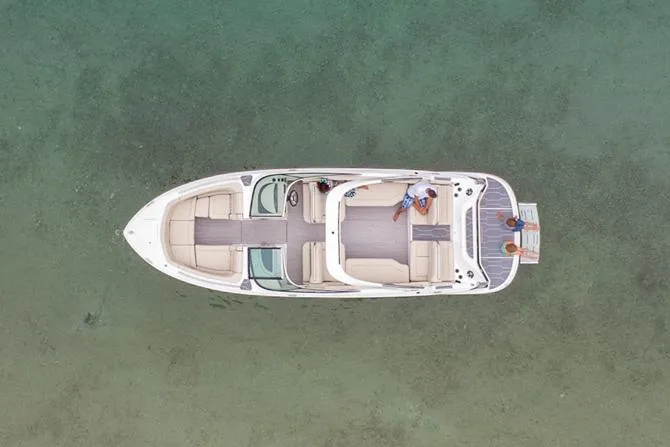 Slide: The Image of 2022 Regal 2800 Bowrider interior seating with diamond-stitched upholstery and armrests. - 9