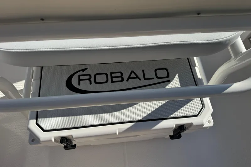 Slide: The Image of 2026 Robalo R202 Explorer boat interior with branded storage compartment. - 13