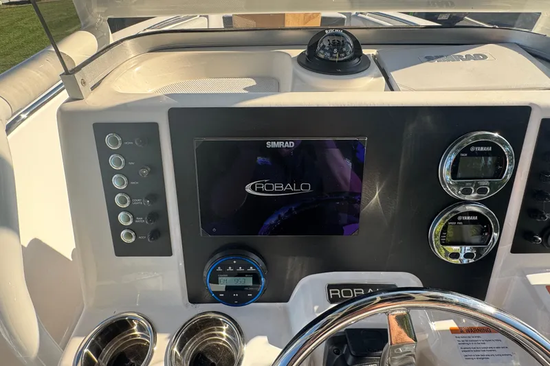 Slide: The Image of 2026 Robalo R202 Explorer dashboard with Simrad display and Yamaha gauges. - 15