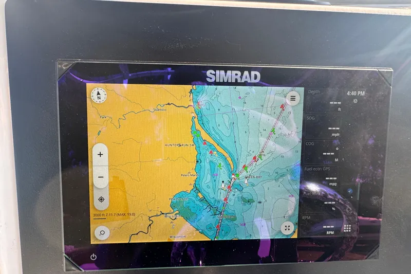 Slide: The Image of Simrad navigation display on 2026 Robalo R202 Explorer boat, showing detailed marine map. - 16