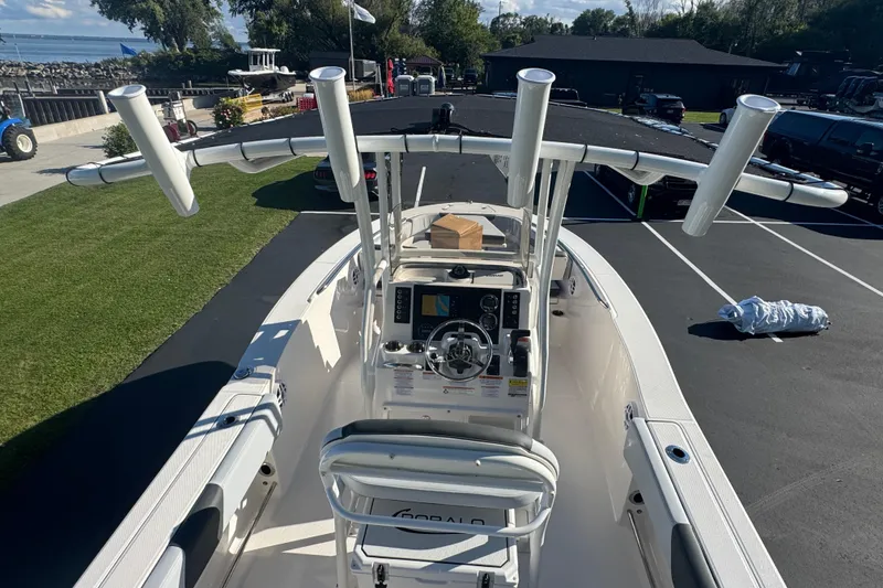 Slide: The Image of 2026 Robalo R202 Explorer boat with center console and rod holders, parked outdoors. - 18