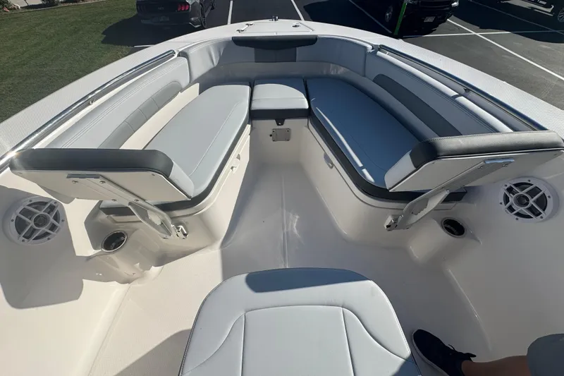 Slide: The Image of 2026 Robalo R202 Explorer boat interior with cushioned seating and speakers. - 19