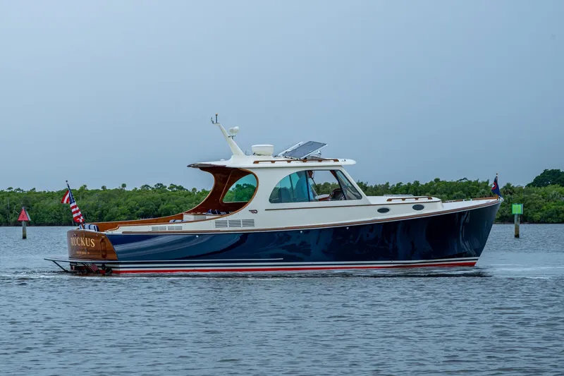 The Image of 2017 Hinckley Picnic Boat 37 MKIII cruising on calm waters, side view. - 0