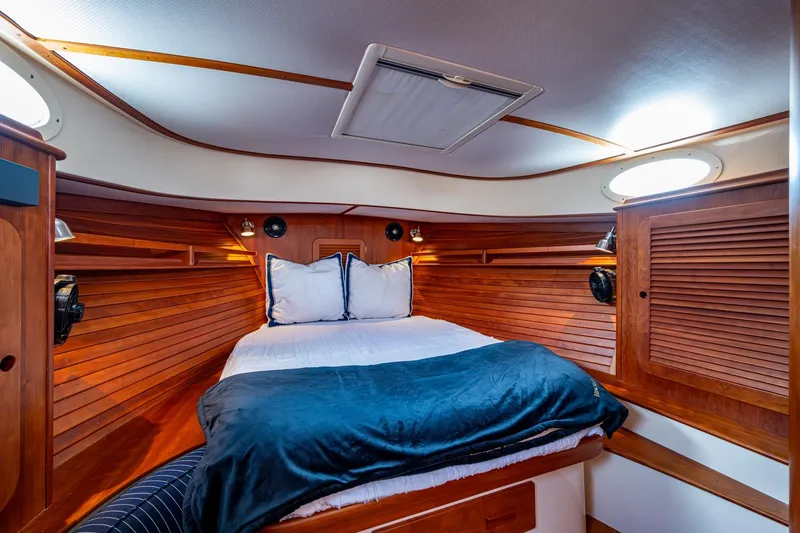 Slide: The Image of Luxurious cabin interior of 2017 Hinckley Picnic Boat 37 MKIII with wooden finishes. - 23