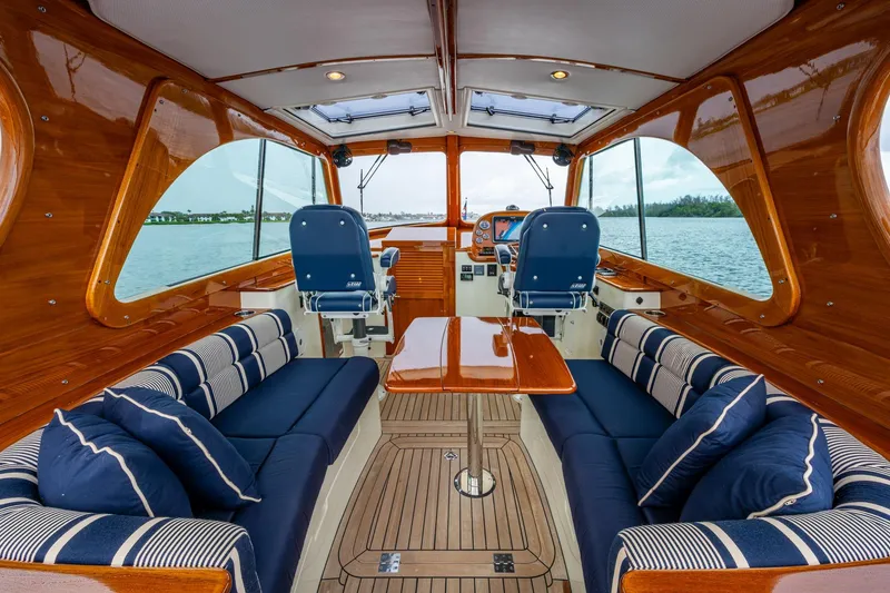 Slide: The Image of Luxurious interior of 2017 Hinckley Picnic Boat 37 MKIII with elegant seating and wood finish. - 10