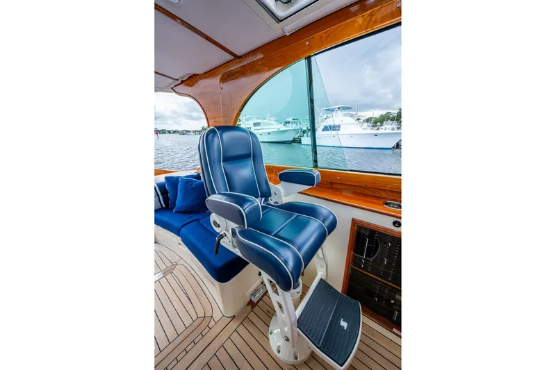 Slide: The Image of Luxurious interior of 2017 Hinckley Picnic Boat 37 MKIII with blue captain's chair. - 12