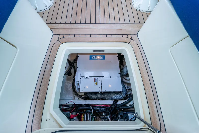 Slide: The Image of Engine compartment of 2017 Hinckley Picnic Boat 37 MKIII with visible mechanical components. - 29