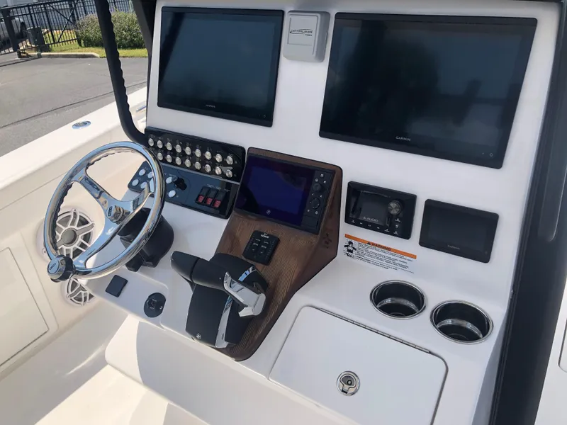 Slide: The Image of 2025 Caymas 30 CT boat dashboard with modern controls and dual screens. - 11
