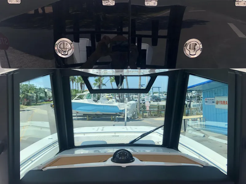 Slide: The Image of 2025 Caymas 30 CT boat dashboard view at marina. - 12
