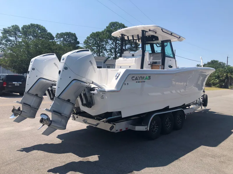 Slide: The Image of 2025 Caymas 30 CT boat with dual engines on a trailer. - 3