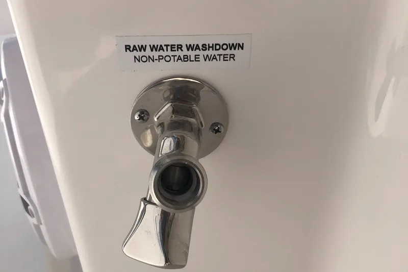 Slide: The Image of Raw water washdown outlet on 2025 Caymas 30 CT boat, labeled non-potable. - 35