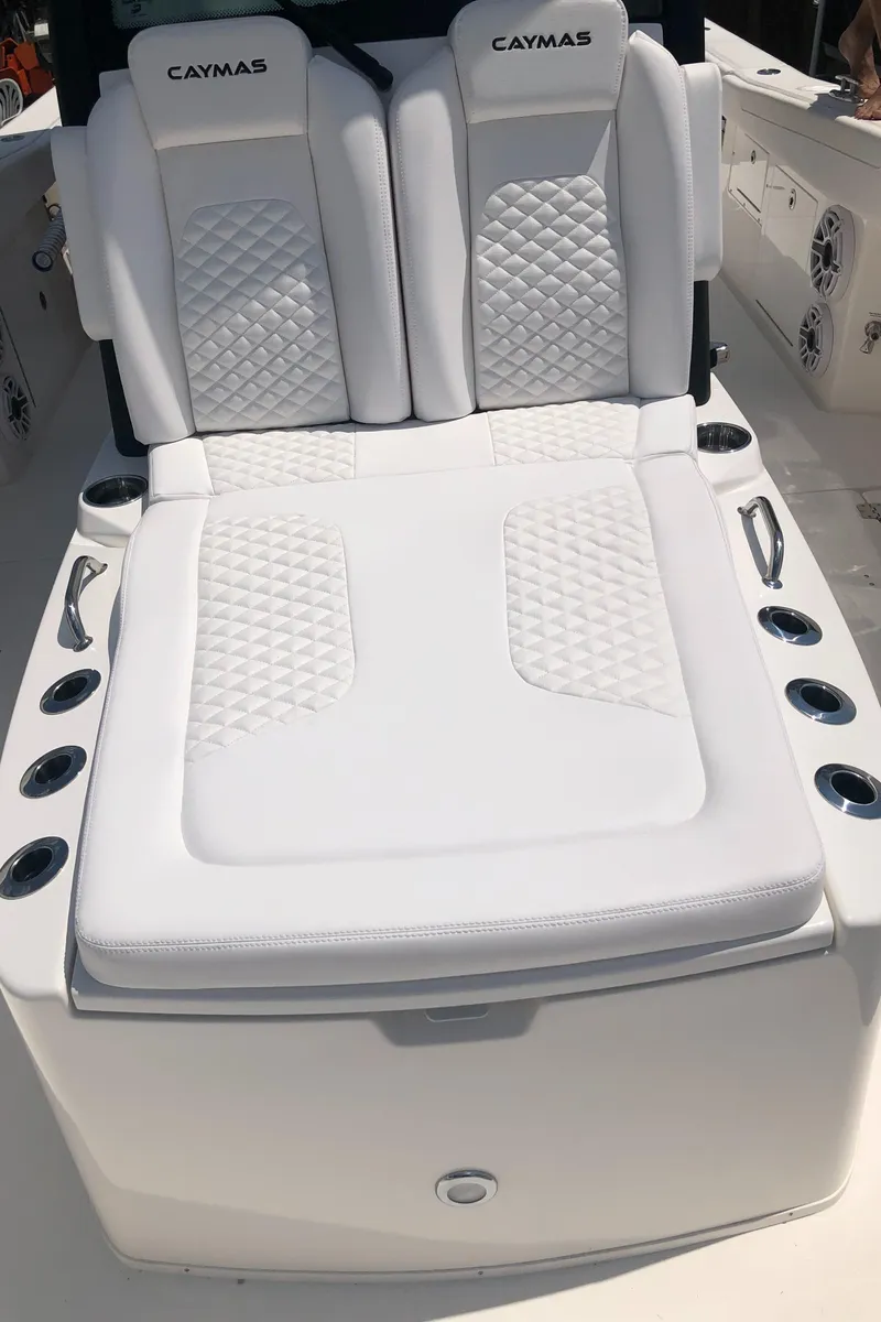 Slide: The Image of 2025 Caymas 30 CT boat with luxurious white seating and cup holders. - 37