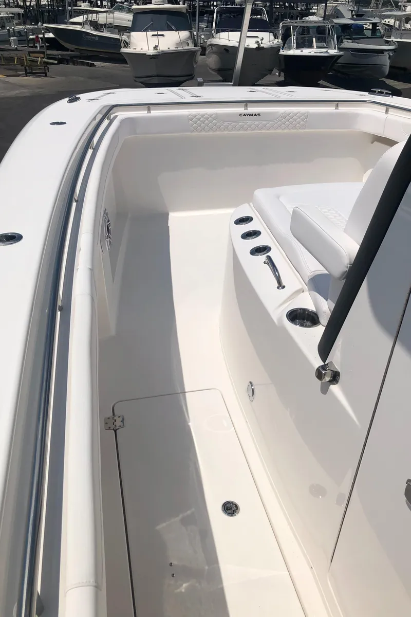 Slide: The Image of 2025 Caymas 30 CT boat interior with sleek white design and seating. - 40