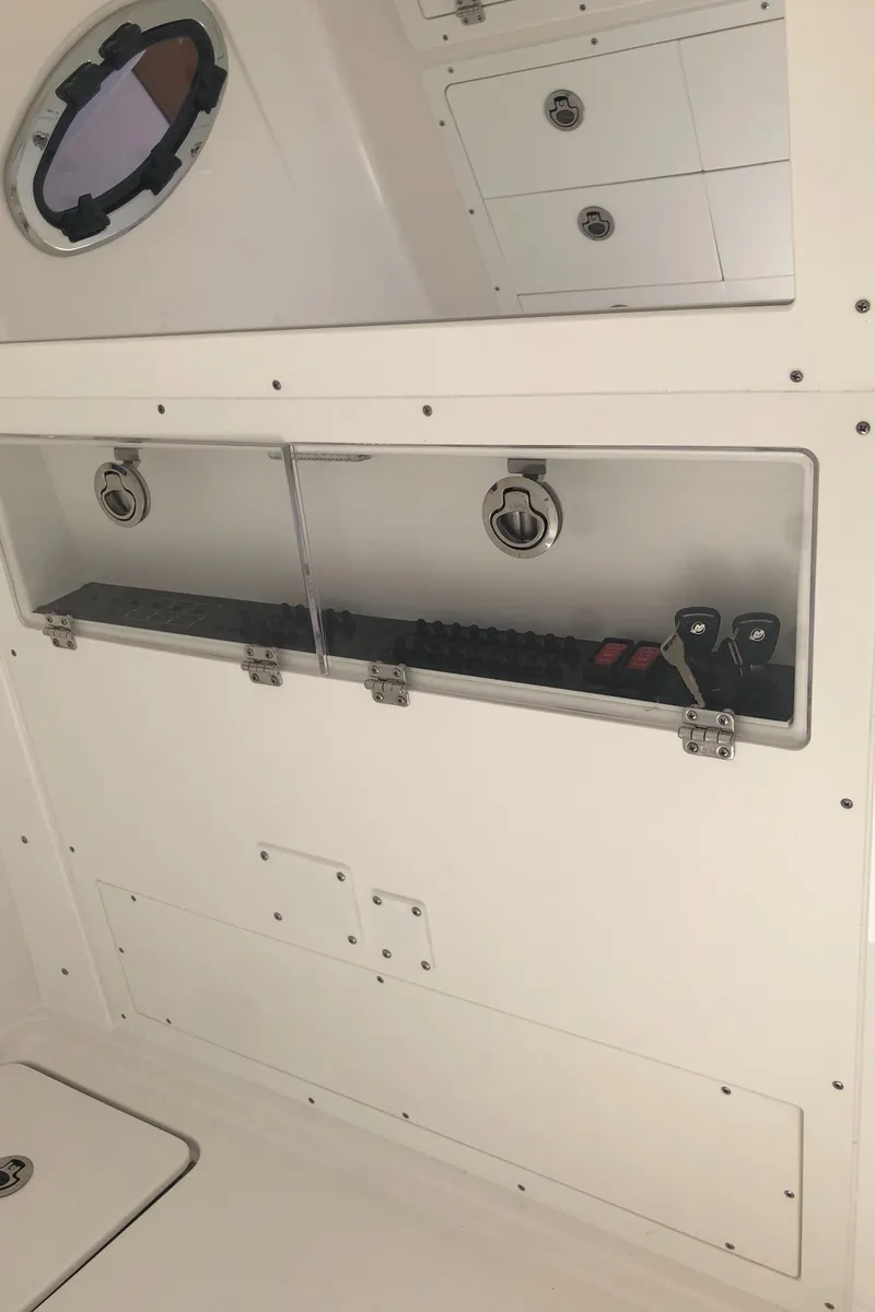 Slide: The Image of 2025 Caymas 30 CT interior storage compartments with secure latches and organized layout. - 41