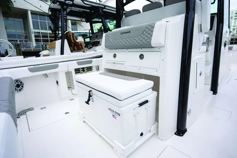 Slide: The Image of 2026 Caymas 30 CT boat interior with seating and storage features. - 47