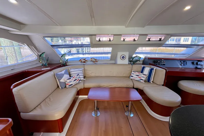 Slide: The Image of Luxurious interior of 2012 Leopard 47 PC yacht with plush seating and elegant decor. - 1