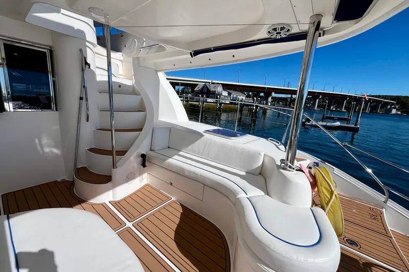 Slide: The Image of Luxurious 2012 Leopard 47 PC yacht interior with elegant seating and scenic waterfront view. - 17
