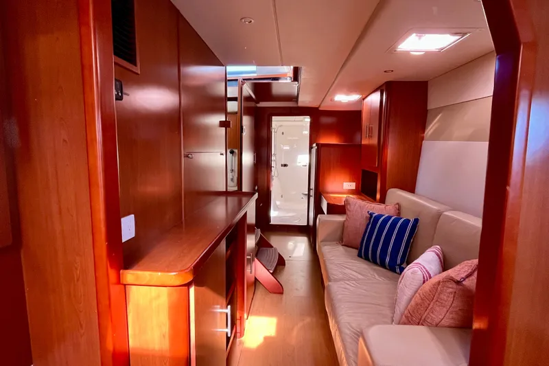 Slide: The Image of Luxurious interior of 2012 Leopard 47 PC Owners' Version yacht with cozy seating and elegant wood finish. - 26