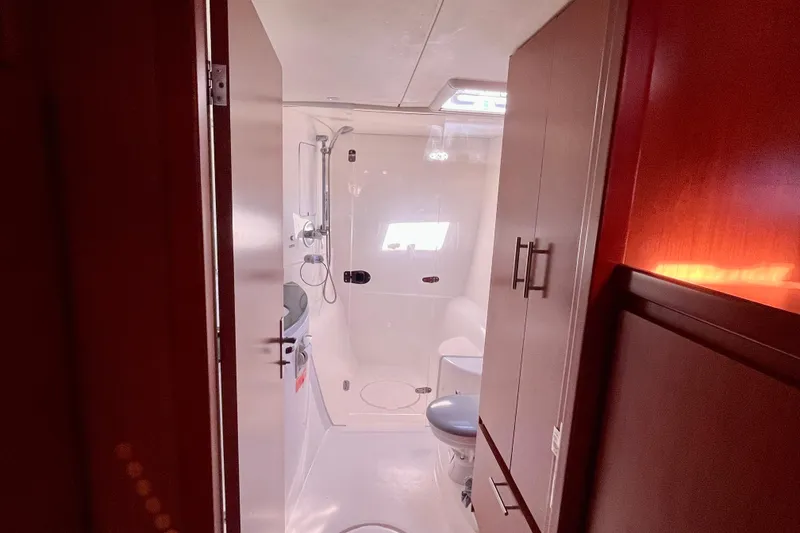 Slide: The Image of Bathroom interior of 2012 Leopard 47 PC Owners' Version yacht, featuring shower and toilet. - 27