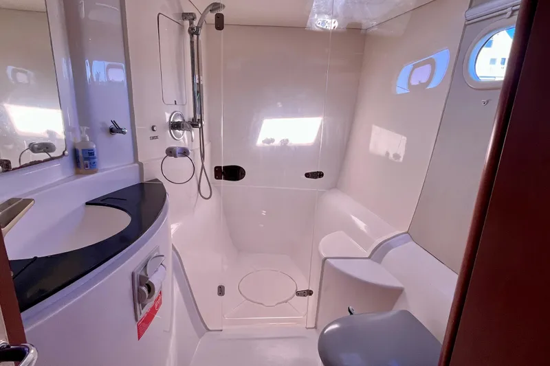 Slide: The Image of Bathroom interior of 2012 Leopard 47 PC Owners' Version yacht, featuring shower and sink. - 28