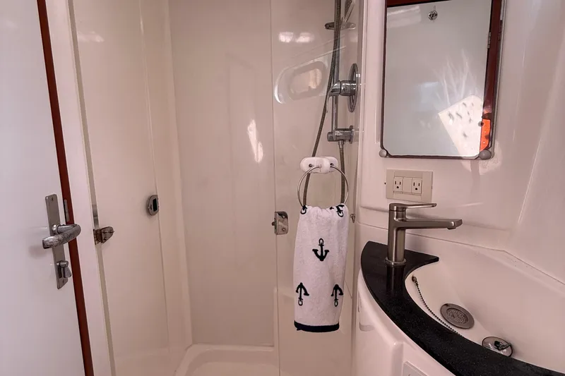Slide: The Image of Bathroom interior of 2012 Leopard 47 PC Owners' Version yacht, featuring shower and sink. - 33