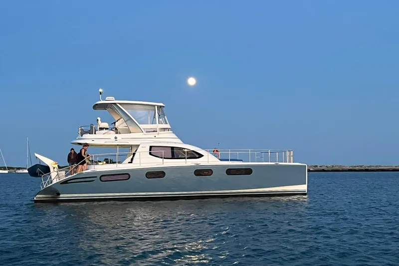 Slide: The Image of 2012 Leopard 47 PC Owners' Version yacht on calm water under a full moon. - 39
