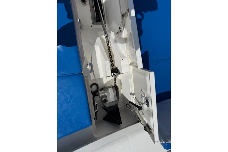 Slide: The Image of Anchor compartment of 2012 Leopard 47 PC Owners' Version catamaran, featuring chain and winch. - 56