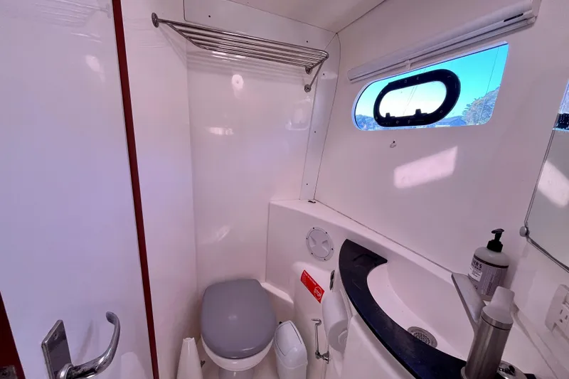 Slide: The Image of Bathroom interior of 2012 Leopard 47 PC Owners' Version yacht, featuring toilet and sink. - 66
