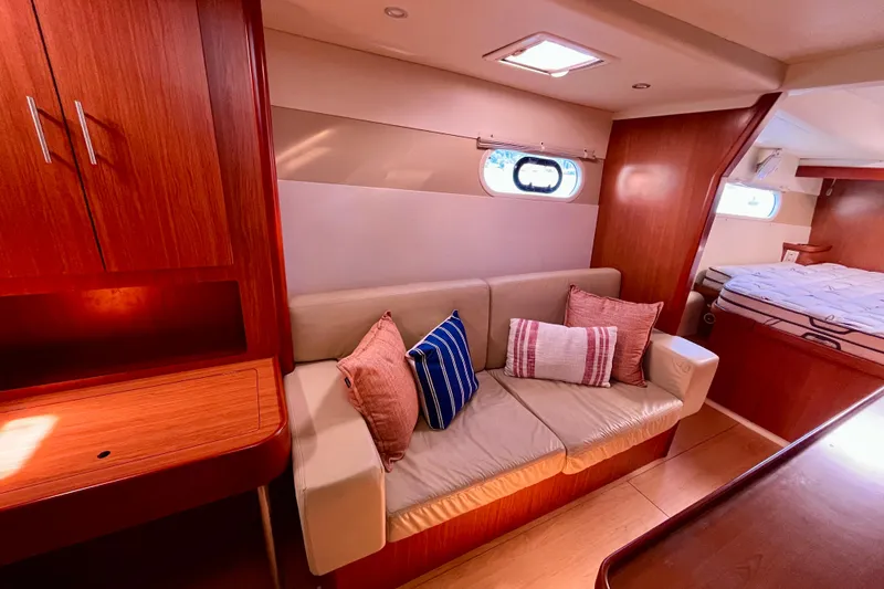 Slide: The Image of Luxurious interior of 2012 Leopard 47 PC yacht with cozy seating and elegant wood finishes. - 77