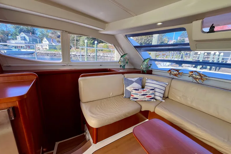 Slide: The Image of Interior of 2012 Leopard 47 PC yacht with cozy seating and decorative pillows. - 78