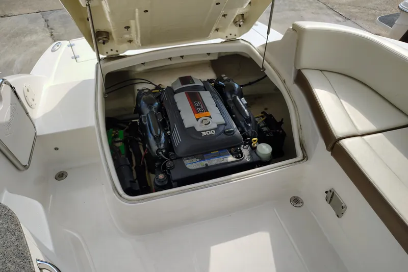 Slide: The Image of 2017 Chaparral 244 Sunesta boat engine compartment with open hatch. - 26