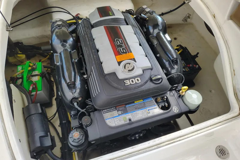 Slide: The Image of Engine compartment of a 2017 Chaparral 244 Sunesta boat, featuring a Mercury 300 engine. - 27