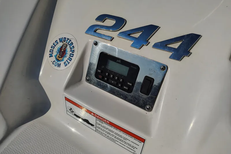 Slide: The Image of 2017 Chaparral 244 Sunesta dashboard with control panel and logo sticker. - 31