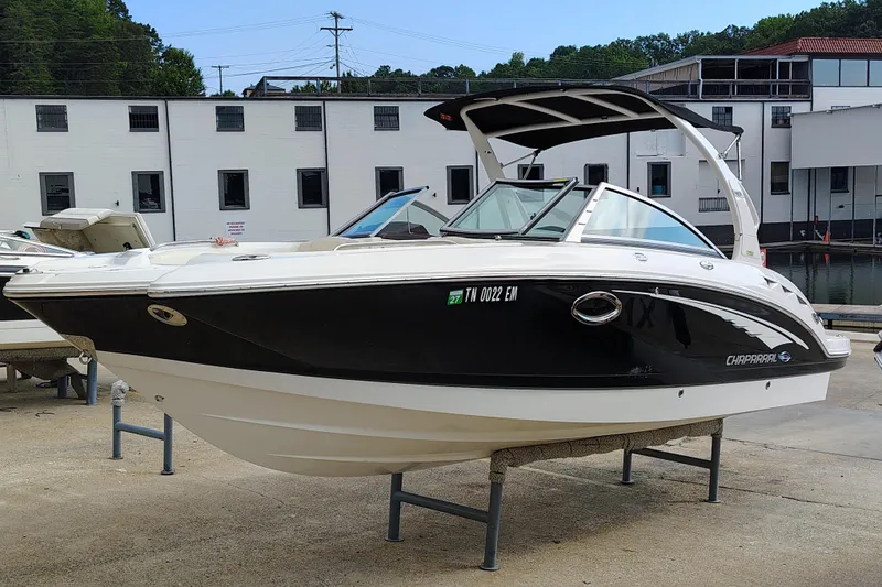Slide: The Image of 2017 Chaparral 244 Sunesta boat displayed outdoors on a stand. - 9