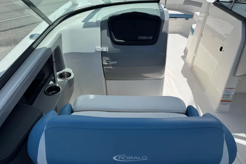 Slide: The Image of 2026 Robalo R317 Dual Console interior with seating and cup holders. - 12