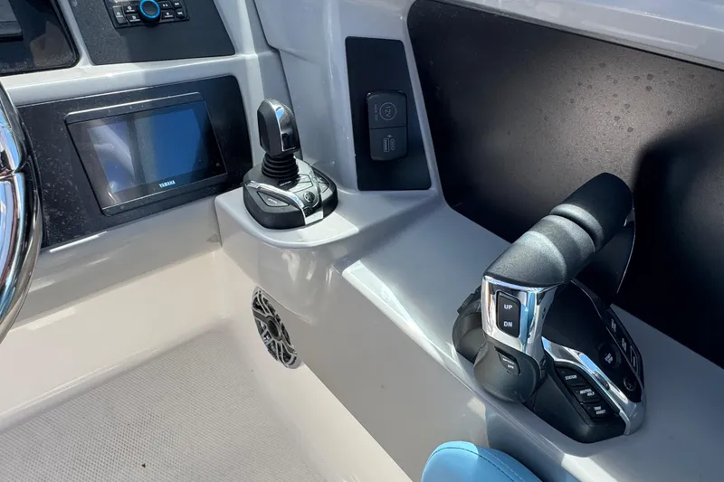 Slide: The Image of 2026 Robalo R317 Dual Console boat controls and dashboard with Yamaha display. - 18