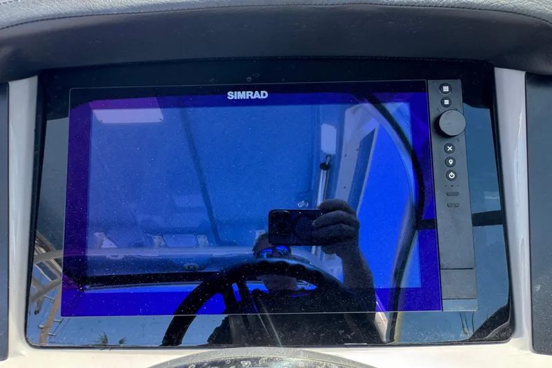 Slide: The Image of Simrad display on 2026 Robalo R317 Dual Console boat dashboard. - 20