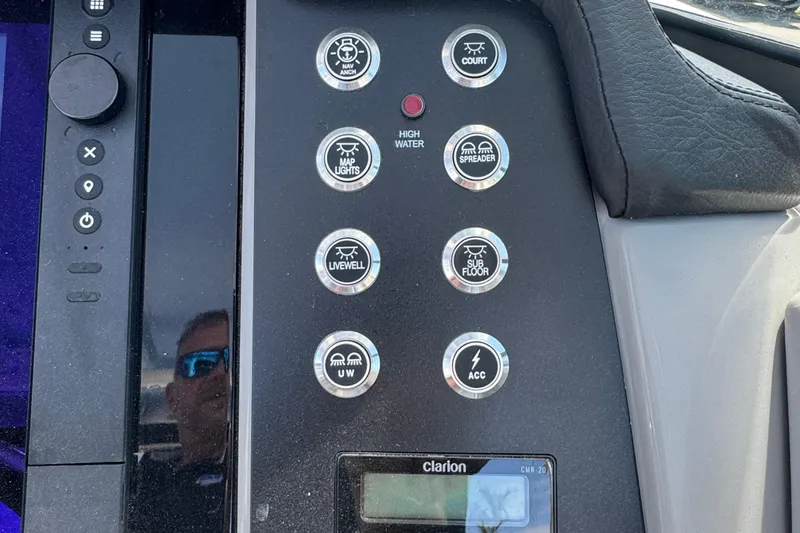 Slide: The Image of Control panel of 2026 Robalo R317 Dual Console boat with various function buttons. - 21