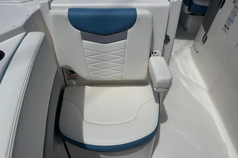 Slide: The Image of 2026 Robalo R317 Dual Console boat seat with white and blue upholstery. - 27