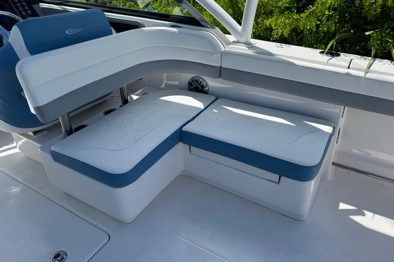 Slide: The Image of 2026 Robalo R317 Dual Console boat interior with blue and white seating. - 8