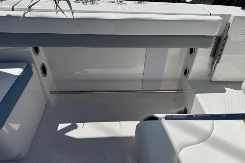 Slide: The Image of 2026 Robalo R317 Dual Console interior seating area with sleek design and modern features. - 9