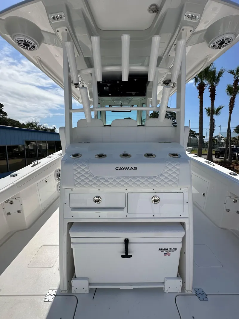 Slide: The Image of 2025 Caymas 34 CT boat interior with storage compartments and cooler. - 10
