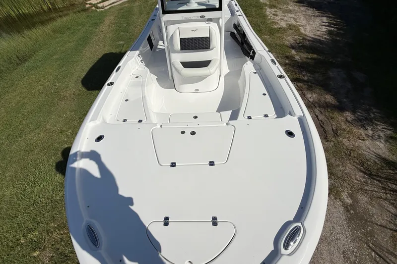 Slide: The Image of 2026 Tidewater 2210 Carolina Bay boat, spacious deck, white finish, outdoor setting. - 18