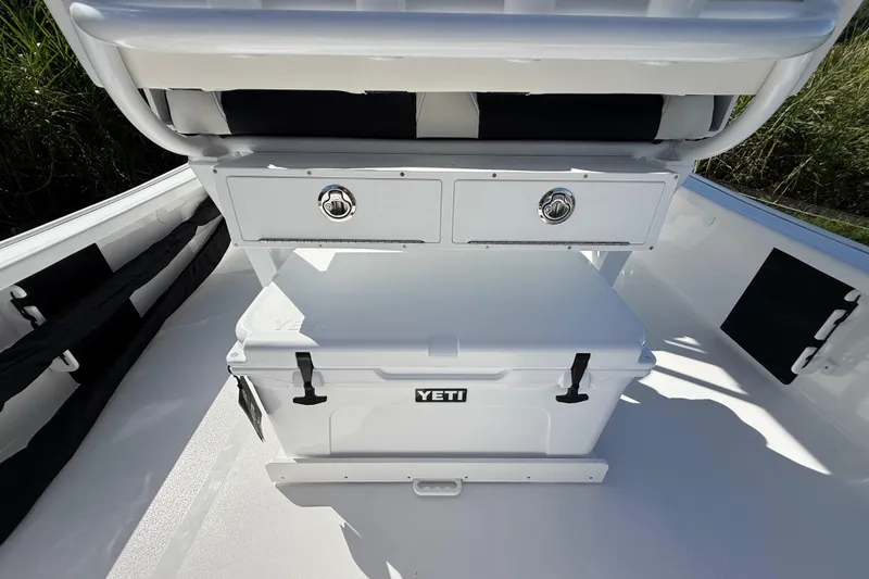 Slide: The Image of 2026 Tidewater 2210 Carolina Bay boat interior with Yeti cooler and storage drawers. - 28