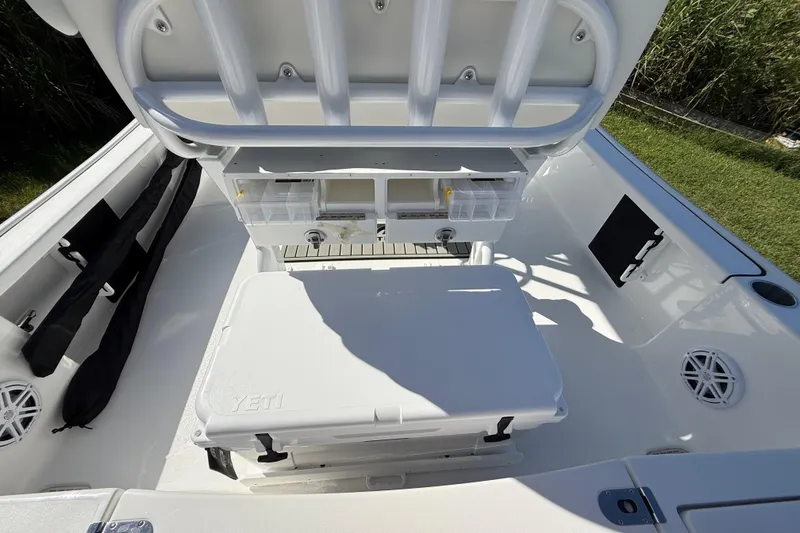 Slide: The Image of 2026 Tidewater 2210 Carolina Bay boat interior with storage and seating. - 34