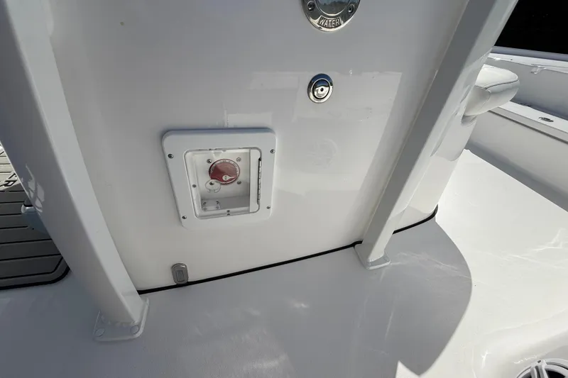 Slide: The Image of 2026 Tidewater 2210 Carolina Bay boat interior, featuring a control panel and water access. - 35