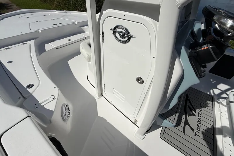 Slide: The Image of 2026 Tidewater 2210 Carolina Bay boat interior, featuring sleek white design and modern console. - 38